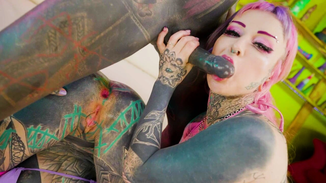Inked Babes Pass Around a Massive Tattooed Dick